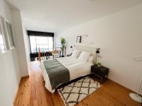 Postel nebo postele na pokoji v ubytování Apartamentos Ciudad Santiago