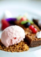 a plate of food with a scoop of ice cream at Hotel Porta do Sol Conference & SPA in Caminha