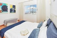 A bed or beds in a room at Stunning Villa with Breathtaking Ocean View