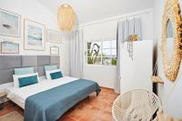 A bed or beds in a room at Stunning Villa with Breathtaking Ocean View