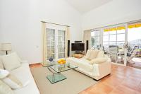 A television and/or entertainment centre at Stunning Villa with Breathtaking Ocean View