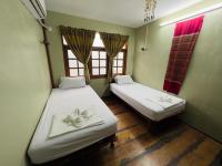 Postel nebo postele na pokoji v ubytování DonMueang Boutique House DonMueang Airport
