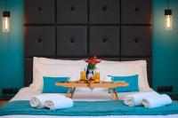 Posteľ alebo postele v izbe v ubytovaní Platinum Suites