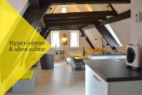 a kitchen and dining room with a yellow ceiling at Bretzel &amp; Raisin - Hypercentre de Colmar in Colmar