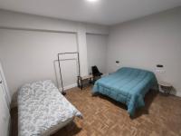 Łóżko lub łóżka w pokoju w obiekcie Céntrico apartamento inteligente