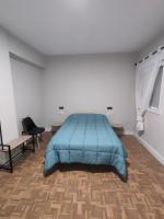Łóżko lub łóżka w pokoju w obiekcie Céntrico apartamento inteligente