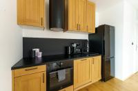 Kuchyňa alebo kuchynka v ubytovaní Apartament SEAGRASS SurfingBird Dźwirzyno