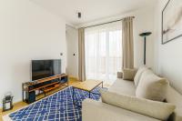 Televízia a/alebo spoločenská miestnosť v ubytovaní Apartament SEAGRASS SurfingBird Dźwirzyno