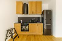 Kuchyňa alebo kuchynka v ubytovaní Apartament SEAGRASS SurfingBird Dźwirzyno