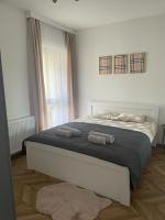 Posteľ alebo postele v izbe v ubytovaní Apartament przy Karmelu