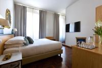 Posteľ alebo postele v izbe v ubytovaní Aramis Deluxe Rooms