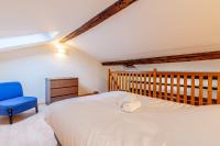 Cama ou camas em um quarto em Sous les Toits de Stanislas
