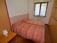 A bed or beds in a room at Apartment Magnolia by Interhome