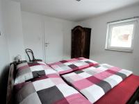 A bed or beds in a room at Apartment Holz by Interhome
