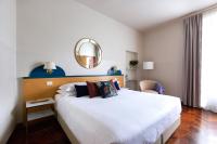 Posteľ alebo postele v izbe v ubytovaní Aramis Deluxe Rooms
