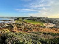 a golf course on a hill next to the ocean at Premium holiday home in top location with sea view, Plougasnou in Plougasnou