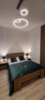 Posteľ alebo postele v izbe v ubytovaní Apartament Mnisza 8