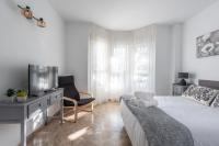 Televízia a/alebo spoločenská miestnosť v ubytovaní Apartamento Puerto Banús IV