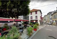 a street with tables and chairs and a building at T2 de charme, centre ville historique de Tarbes in Tarbes