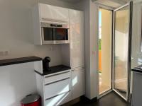 Kuchyňa alebo kuchynka v ubytovaní Magnifique appartement climatisé de 87m², à 100m de la plage