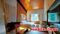 a bedroom with a white bed and a wooden ceiling at Tingtau Villa in Lugu Lake