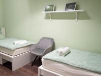 Łóżko lub łóżka w pokoju w obiekcie Pajger Apartman Egyetemváros