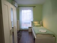 Łóżko lub łóżka w pokoju w obiekcie Pajger Apartman Egyetemváros