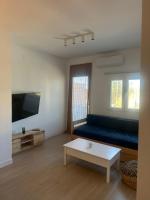 TV a/nebo společenská místnost v ubytování Apartamentos Buganvilla Roquetas de Mar
