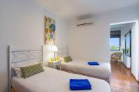 A bed or beds in a room at Villa Maria by Villa Plus