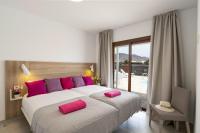 A bed or beds in a room at Villa Muzu by Villa Plus