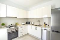 A kitchen or kitchenette at Villa Muzu by Villa Plus