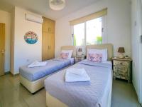 Postel nebo postele na pokoji v ubytování Nissi beach villa Magnolia