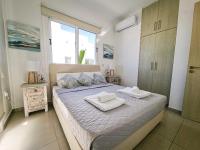 Postel nebo postele na pokoji v ubytování Nissi beach villa Magnolia