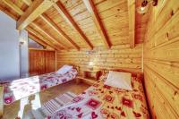 Łóżko lub łóżka w pokoju w obiekcie Chalet l'Hermine