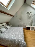 Łóżko lub łóżka w pokoju w obiekcie Duplex tout confort dans Boulogne