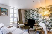 Telewizja i/lub zestaw kina domowego w obiekcie Le 37 - Maison 2 chambres en bord de mer