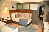 Postel nebo postele na pokoji v ubytování Seaden Quality Resort & Spa Ultra All Inclusive