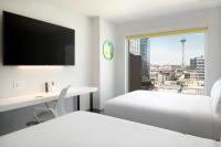 Astra Hotel, Seattle, a Tribute Portfolio Hotel by Marriottにあるベッド