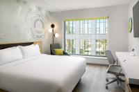 Astra Hotel, Seattle, a Tribute Portfolio Hotel by Marriottにあるベッド