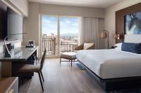 a hotel room with a bed and a desk and a window at San Juan Marriott Resort and Stellaris Casino in San Juan