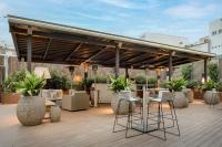 a patio with chairs and tables and a pavilion at SH Colón Valencia in Valencia