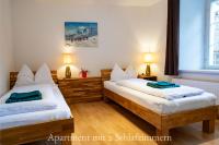 A bed or beds in a room at Astoria Apartments