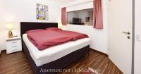 A bed or beds in a room at Astoria Apartments