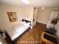 A bed or beds in a room at Astoria Apartments