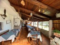 a restaurant with tables and chairs in a room at Visit.Antonimina | home in Antonimina