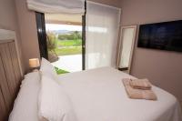 Postel nebo postele na pokoji v ubytování Destino Deluxe Valle del Este Vera