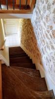 a staircase in a building with a stair case at Maison proche de Disneyland, de Paris et des JO in Pomponne