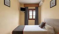Łóżko lub łóżka w pokoju w obiekcie HOSTAL-RESTAURANTE EL PAISANO