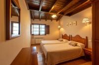 Postel nebo postele na pokoji v ubytování Casa Rural La Indiana I y II