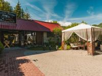 a white tent in front of a building at Bobcikowa Chata in Szczawnica